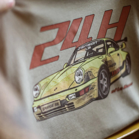 Beige tote bag with a graphic of a vintage race car and '24H' text on a blurred background